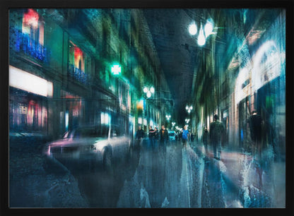An abstract, moody artwork of a busy city street at night, viewed as if through a rainy window or with motion blur. The scene is dominated by shades of deep blue and vibrant green, with glowing streetlights and neon signs casting reflections on the wet pavement. Silhouettes of people walk down the street, and a car is partially visible on the left. The entire composition has a dynamic, dreamlike quality and is presented in a silver frame. Poster