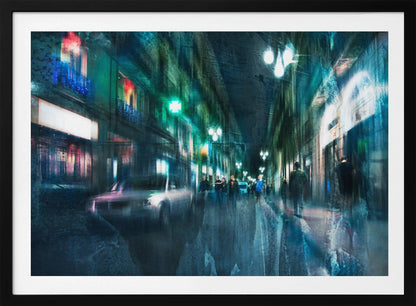 An abstract, moody artwork of a busy city street at night, viewed as if through a rainy window or with motion blur. The scene is dominated by shades of deep blue and vibrant green, with glowing streetlights and neon signs casting reflections on the wet pavement. Silhouettes of people walk down the street, and a car is partially visible on the left. The entire composition has a dynamic, dreamlike quality and is presented in a silver frame. Poster