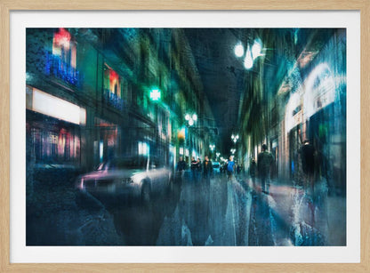 An abstract, moody artwork of a busy city street at night, viewed as if through a rainy window or with motion blur. The scene is dominated by shades of deep blue and vibrant green, with glowing streetlights and neon signs casting reflections on the wet pavement. Silhouettes of people walk down the street, and a car is partially visible on the left. The entire composition has a dynamic, dreamlike quality and is presented in a silver frame. Poster