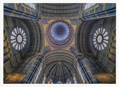 An upward-looking view of the highly ornate vaulted ceiling of a grand cathedral, featuring a central glass dome, large rose windows, and intricate gold and blue details, all framed in silver. Poster
