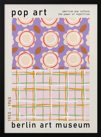 A framed pop art museum poster advertising an exhibition at the Berlin Art Museum. The poster features two distinct patterns. The top section has repeating stylized cream and red flowers on a purple background, with the words 'pop art' and 'american pop culture the power of repetition'. The bottom section displays a pink, green, and orange plaid pattern. The dates '1950 - 1960' are printed vertically on the side. Artwork
