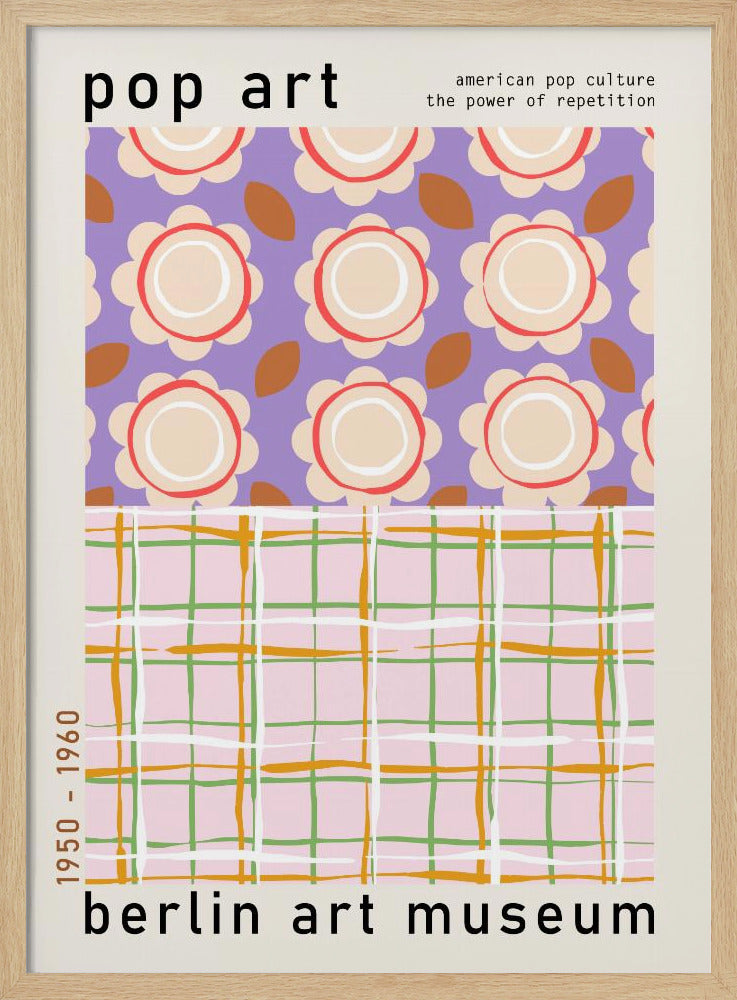 A framed pop art museum poster advertising an exhibition at the Berlin Art Museum. The poster features two distinct patterns. The top section has repeating stylized cream and red flowers on a purple background, with the words 'pop art' and 'american pop culture the power of repetition'. The bottom section displays a pink, green, and orange plaid pattern. The dates '1950 - 1960' are printed vertically on the side. Artwork