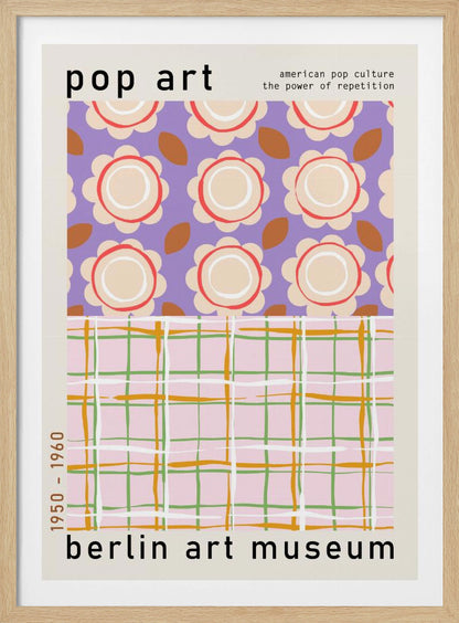 A framed pop art museum poster advertising an exhibition at the Berlin Art Museum. The poster features two distinct patterns. The top section has repeating stylized cream and red flowers on a purple background, with the words 'pop art' and 'american pop culture the power of repetition'. The bottom section displays a pink, green, and orange plaid pattern. The dates '1950 - 1960' are printed vertically on the side. Artwork