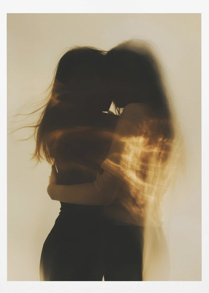 An artistic, long-exposure photograph of two silhouetted figures embracing. Their forms are blurred with motion, and streaks of warm, golden light wash over them against a soft, off-white background, creating a dreamy and intimate mood. Decor