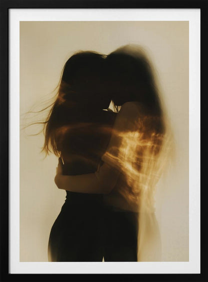 An artistic, long-exposure photograph of two silhouetted figures embracing. Their forms are blurred with motion, and streaks of warm, golden light wash over them against a soft, off-white background, creating a dreamy and intimate mood. Decor