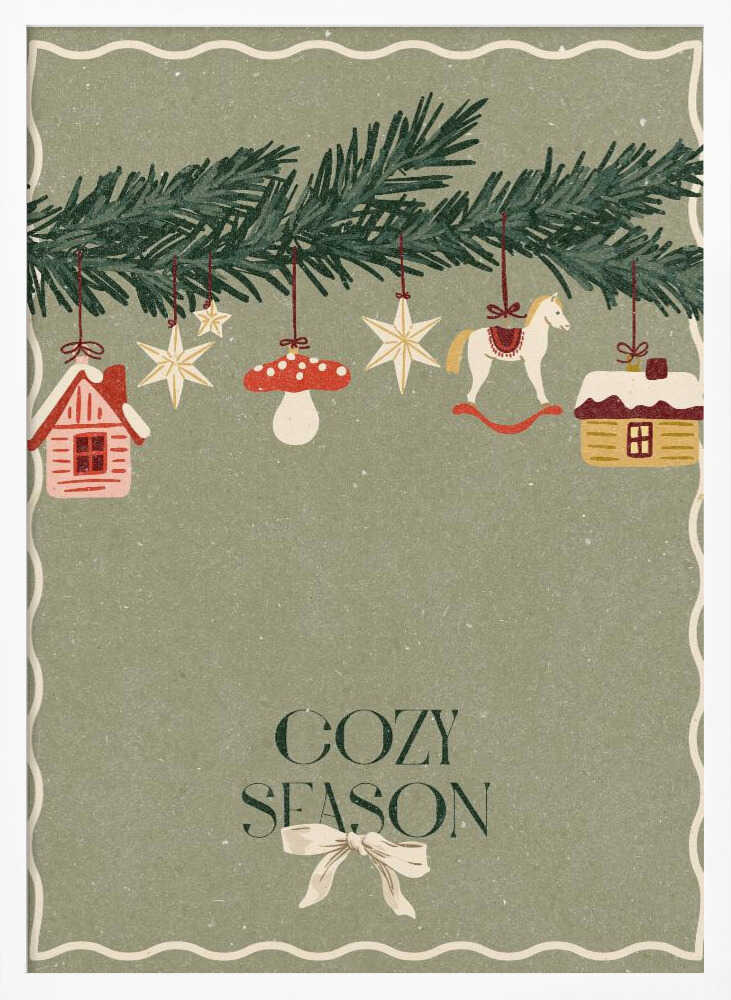 A vintage-style holiday poster with a sage green background. A pine branch hangs at the top, decorated with illustrated ornaments including houses, stars, a mushroom, and a rocking horse. Below, the text 'COZY SEASON' is written in a dark serif font with a light-colored bow underneath. Artwork