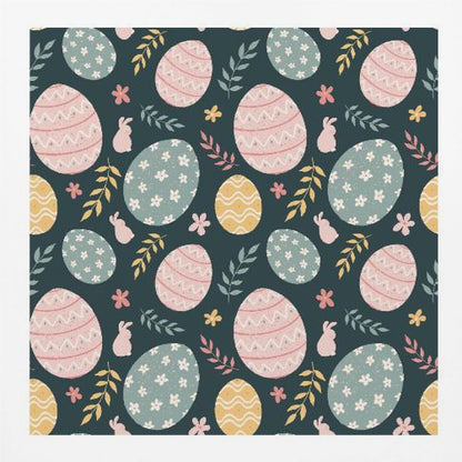 A framed piece of art with a repeating Easter pattern on a dark teal background. The pattern features decorated eggs in pink, light blue, and yellow, alongside small pink bunny silhouettes and colorful sprigs of leaves and flowers. Poster
