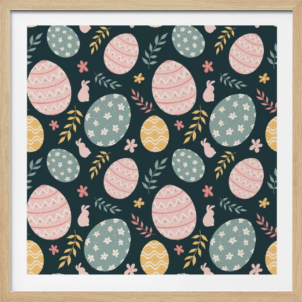 A framed piece of art with a repeating Easter pattern on a dark teal background. The pattern features decorated eggs in pink, light blue, and yellow, alongside small pink bunny silhouettes and colorful sprigs of leaves and flowers. Poster