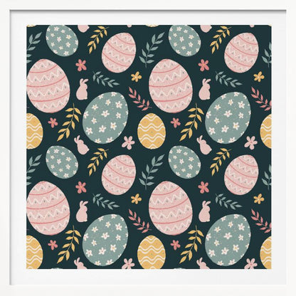 A framed piece of art with a repeating Easter pattern on a dark teal background. The pattern features decorated eggs in pink, light blue, and yellow, alongside small pink bunny silhouettes and colorful sprigs of leaves and flowers. Poster