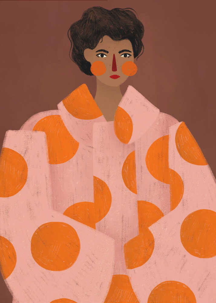 A stylized portrait illustration of a person with dark curly hair and warm brown skin against a solid reddish-brown background. They wear a light pink, oversized coat with large orange polka dots, and look directly forward with a neutral expression, accented by red lipstick and circular orange blush. Decor