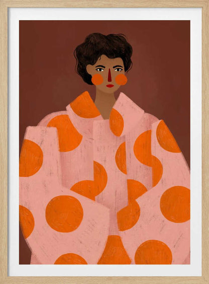 A stylized portrait illustration of a person with dark curly hair and warm brown skin against a solid reddish-brown background. They wear a light pink, oversized coat with large orange polka dots, and look directly forward with a neutral expression, accented by red lipstick and circular orange blush. Decor