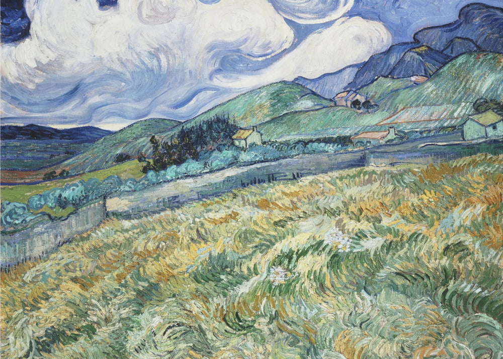 A framed Post-Impressionist painting by Vincent van Gogh depicting a vibrant, rolling landscape. The foreground is filled with swirling brushstrokes of green and yellow fields, leading back to green hills dotted with small houses. In the background, dark blue mountains rise up to meet a dramatic sky filled with large, swirling white clouds against a deep blue. Wall Art