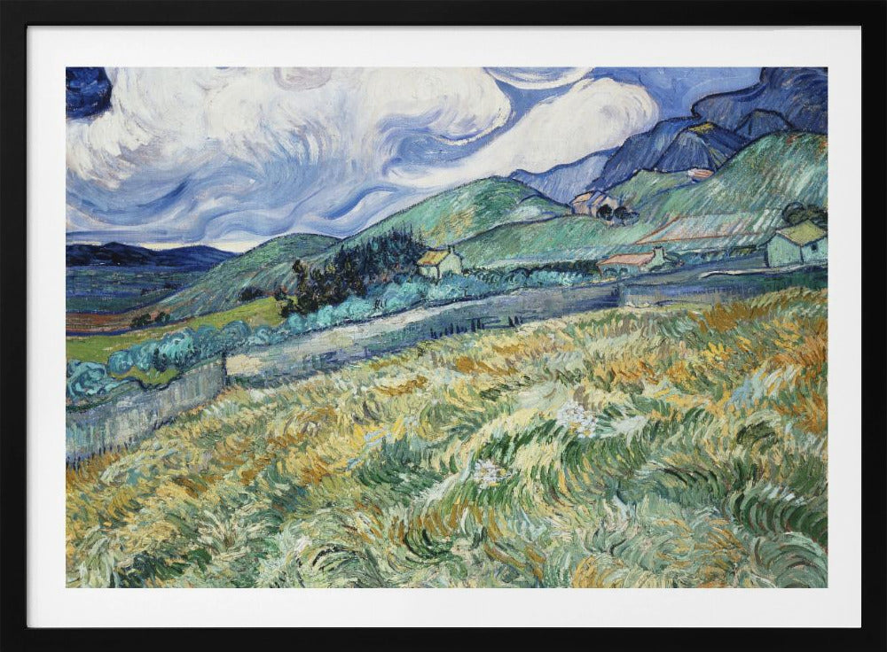 A framed Post-Impressionist painting by Vincent van Gogh depicting a vibrant, rolling landscape. The foreground is filled with swirling brushstrokes of green and yellow fields, leading back to green hills dotted with small houses. In the background, dark blue mountains rise up to meet a dramatic sky filled with large, swirling white clouds against a deep blue. Wall Art