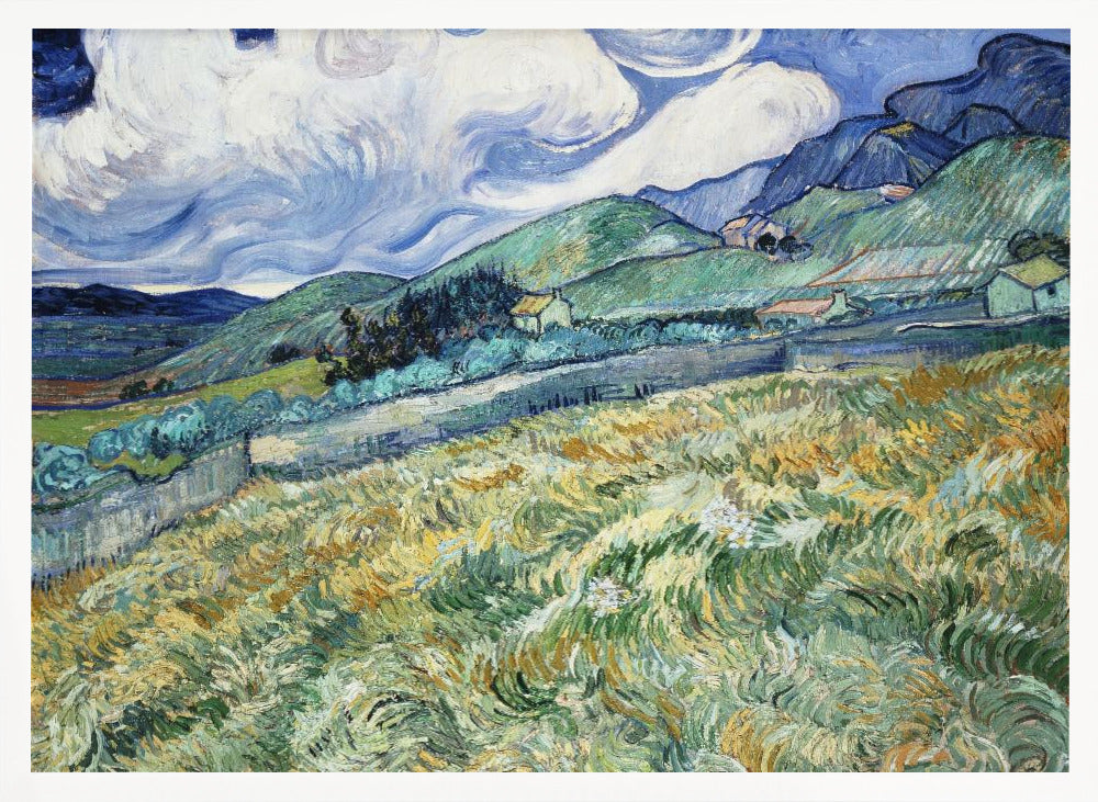 A framed Post-Impressionist painting by Vincent van Gogh depicting a vibrant, rolling landscape. The foreground is filled with swirling brushstrokes of green and yellow fields, leading back to green hills dotted with small houses. In the background, dark blue mountains rise up to meet a dramatic sky filled with large, swirling white clouds against a deep blue. Wall Art