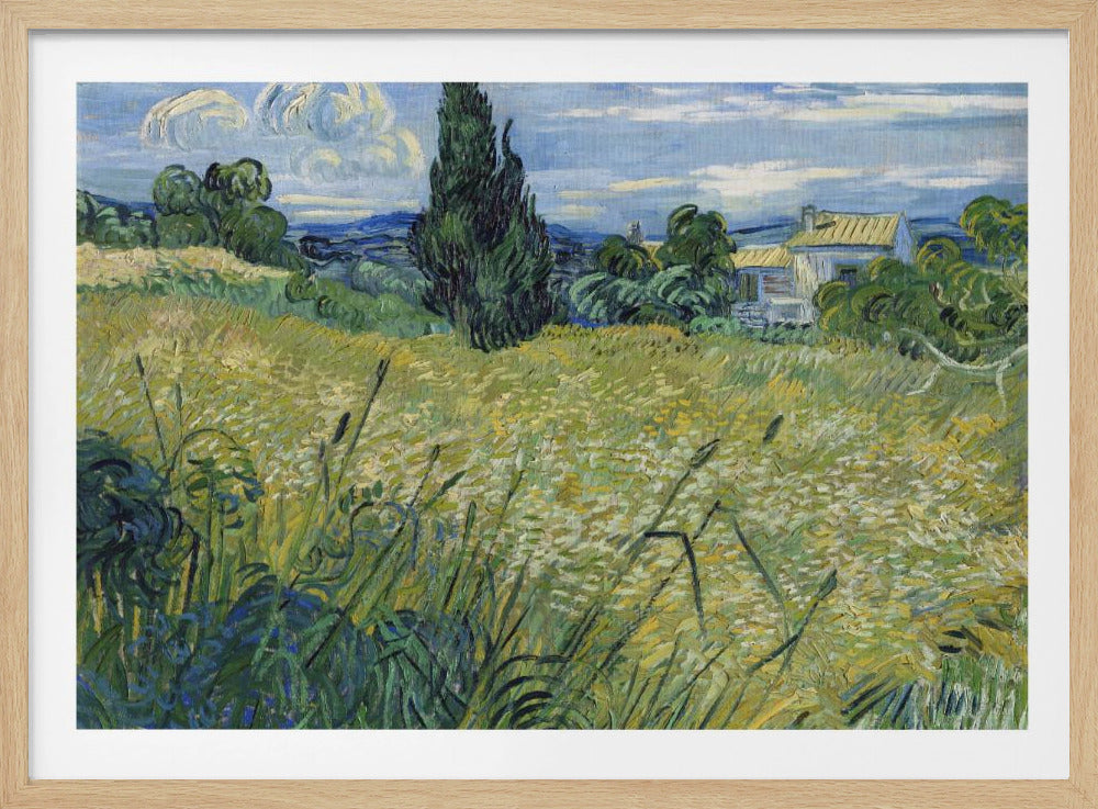 Vincent van Gogh's painting 'Green Wheat Field with Cypress' in a silver frame. The artwork features a vibrant golden-yellow field with green stalks in the foreground, a towering dark green cypress tree at the center, and a small farmhouse in the background under a blue sky with stylized, swirling white clouds. The entire scene is rendered in the artist's characteristic thick, expressive brushstrokes. Print