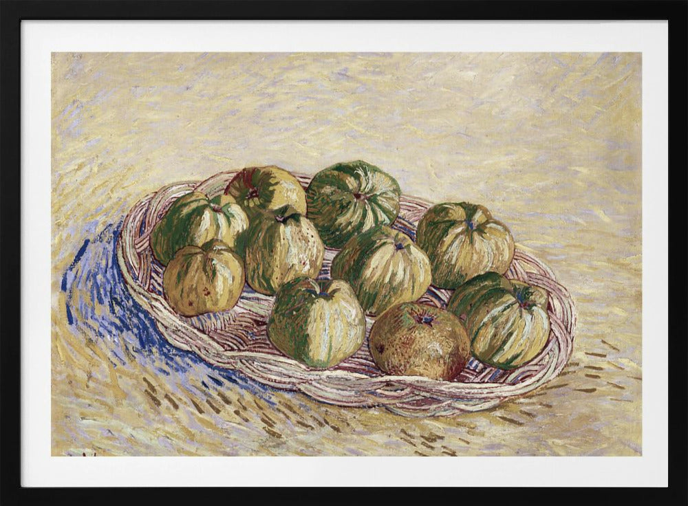 A post-impressionist still life painting by Vincent van Gogh showing a woven basket full of green and yellow apples. The background is a textured pale yellow, and the artist's signature is visible in the bottom left. The artwork is presented in a silver frame. Poster