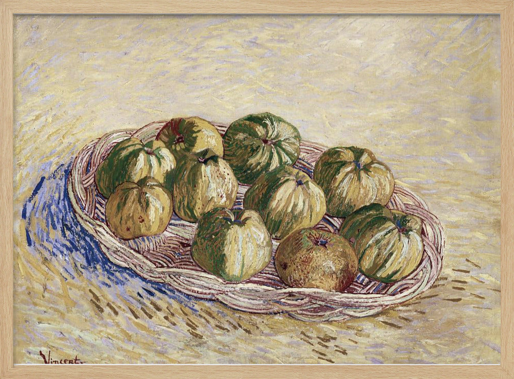 A post-impressionist still life painting by Vincent van Gogh showing a woven basket full of green and yellow apples. The background is a textured pale yellow, and the artist's signature is visible in the bottom left. The artwork is presented in a silver frame. Poster