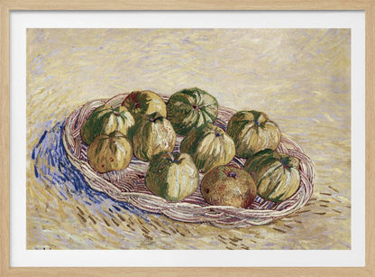 A post-impressionist still life painting by Vincent van Gogh showing a woven basket full of green and yellow apples. The background is a textured pale yellow, and the artist's signature is visible in the bottom left. The artwork is presented in a silver frame. Poster