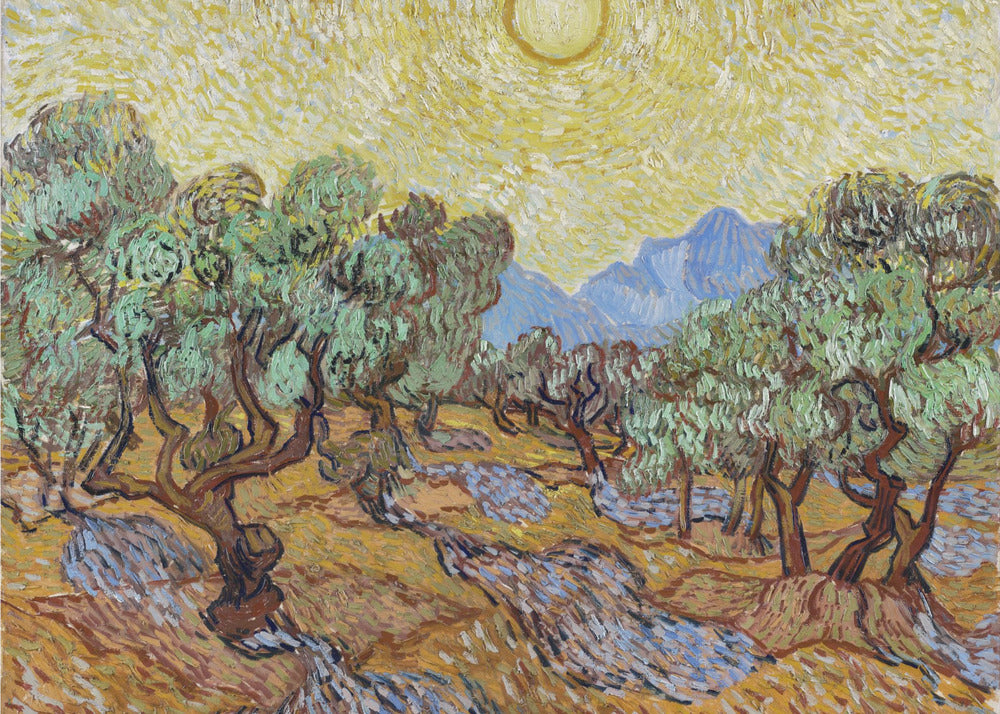 A framed Post-Impressionist painting by Vincent van Gogh depicting an olive grove under a bright yellow sun and sky. The olive trees have gnarled brown trunks and green leaves, set against a rolling landscape of ochre and lavender shadows. In the distance, blue mountains rise against the vibrant sky. The entire scene is painted with thick, energetic brushstrokes. Decor