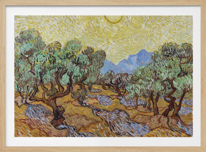A framed Post-Impressionist painting by Vincent van Gogh depicting an olive grove under a bright yellow sun and sky. The olive trees have gnarled brown trunks and green leaves, set against a rolling landscape of ochre and lavender shadows. In the distance, blue mountains rise against the vibrant sky. The entire scene is painted with thick, energetic brushstrokes. Decor