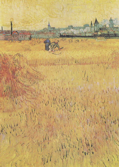 A Post-Impressionist painting by Vincent van Gogh depicting a vast, golden wheat field under a yellow sky. Two figures are harvesting wheat in the middle distance, with a town and industrial buildings on the horizon. The artwork is characterized by thick, textured brushstrokes and is displayed in a black frame. Print