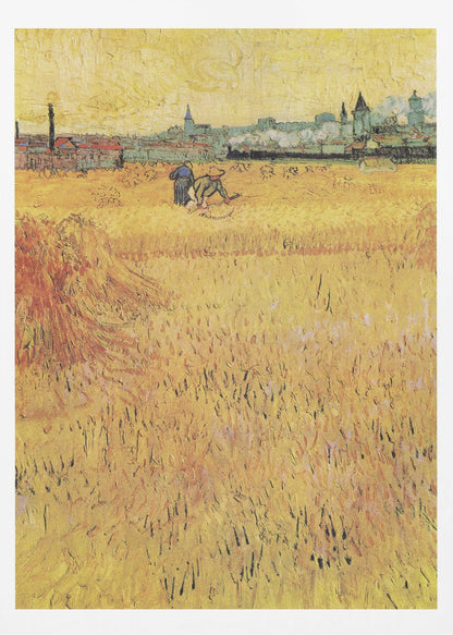 A Post-Impressionist painting by Vincent van Gogh depicting a vast, golden wheat field under a yellow sky. Two figures are harvesting wheat in the middle distance, with a town and industrial buildings on the horizon. The artwork is characterized by thick, textured brushstrokes and is displayed in a black frame. Print
