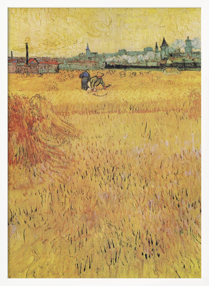 A Post-Impressionist painting by Vincent van Gogh depicting a vast, golden wheat field under a yellow sky. Two figures are harvesting wheat in the middle distance, with a town and industrial buildings on the horizon. The artwork is characterized by thick, textured brushstrokes and is displayed in a black frame. Print