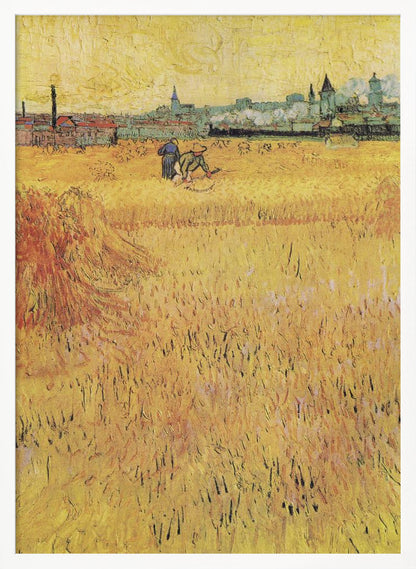 A Post-Impressionist painting by Vincent van Gogh depicting a vast, golden wheat field under a yellow sky. Two figures are harvesting wheat in the middle distance, with a town and industrial buildings on the horizon. The artwork is characterized by thick, textured brushstrokes and is displayed in a black frame. Print