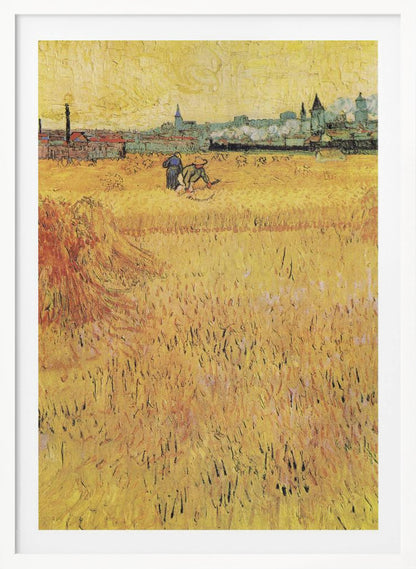 A Post-Impressionist painting by Vincent van Gogh depicting a vast, golden wheat field under a yellow sky. Two figures are harvesting wheat in the middle distance, with a town and industrial buildings on the horizon. The artwork is characterized by thick, textured brushstrokes and is displayed in a black frame. Print