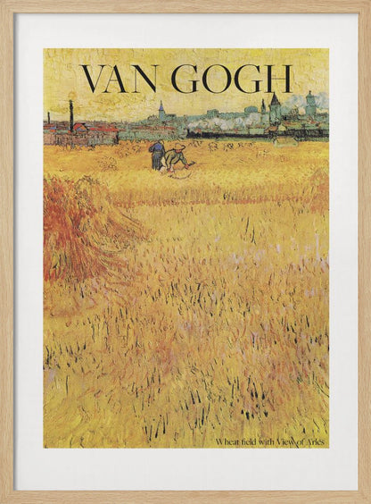 A framed poster of Vincent van Gogh's painting 'Wheat Field with View of Arles'. The impressionist artwork features a vast, textured golden wheat field with harvesters, and the city of Arles in the background. The title 'VAN GOGH' is printed prominently at the top. Decor