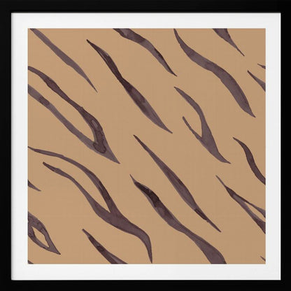 A framed piece of art featuring an abstract pattern of dark, purplish-brown tiger stripes painted in a watercolor style, arranged diagonally on a solid tan background, all enclosed within a light wood frame. Decor