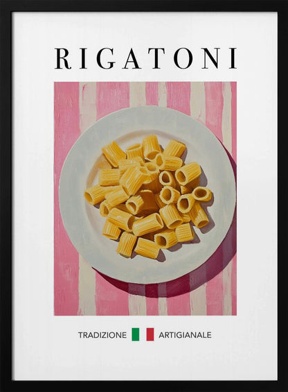 A framed art print of a vintage-style Italian food poster. It features a painting of a white plate full of uncooked rigatoni pasta on a pink and white striped background. The word 'RIGATONI' is printed in large black letters at the top, and 'TRADIZIONE ARTIGIANALE' with a small Italian flag is printed at the bottom. Artwork