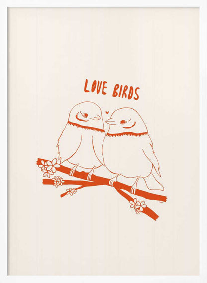 A framed art print featuring a minimalist, reddish-orange illustration on a cream background. Two cartoonish, plump birds sit close together on a flowering branch, looking at each other affectionately. Above them, the text 'LOVE BIRDS' is written in a playful, rounded font. Decor