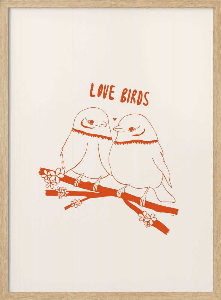 A framed art print featuring a minimalist, reddish-orange illustration on a cream background. Two cartoonish, plump birds sit close together on a flowering branch, looking at each other affectionately. Above them, the text 'LOVE BIRDS' is written in a playful, rounded font. Decor