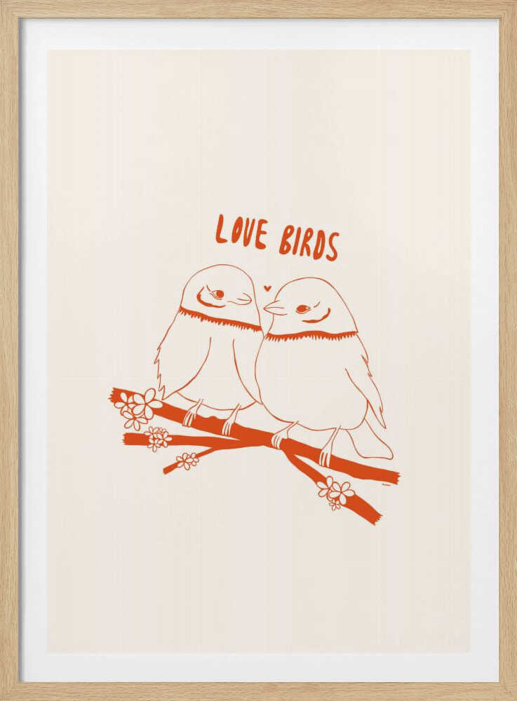 A framed art print featuring a minimalist, reddish-orange illustration on a cream background. Two cartoonish, plump birds sit close together on a flowering branch, looking at each other affectionately. Above them, the text 'LOVE BIRDS' is written in a playful, rounded font. Decor
