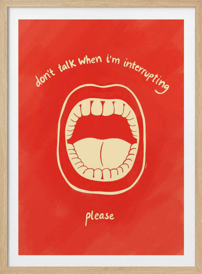 A humorous framed poster with a red background featuring a cream-colored line drawing of a large, open mouth. Above the mouth, the text reads 'don't talk when i'm interrupting' in an arch, and below it says 'please'. Print
