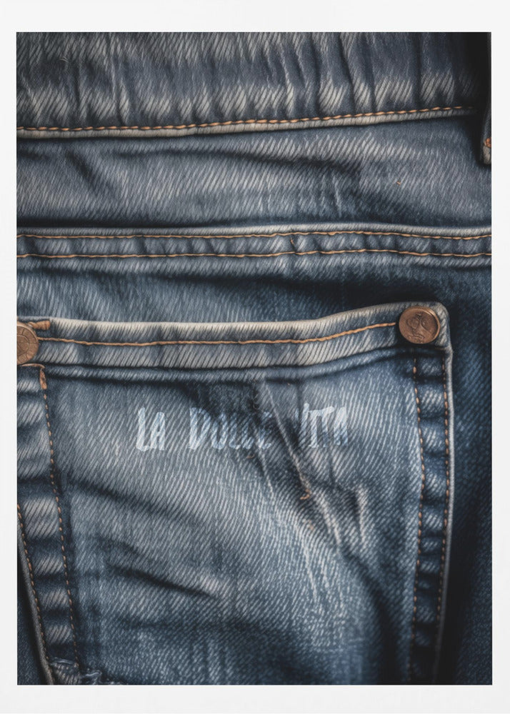 A detailed close-up photograph of a faded blue jean back pocket, showing the texture of the denim, orange stitching, and a copper rivet. Faint white text is stenciled onto the pocket. Poster
