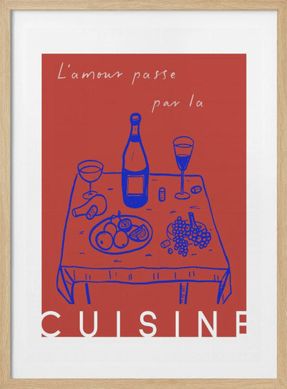 A vintage-style poster with a red background featuring a blue line drawing of a dinner table set with wine and fruit. Above the image is the French phrase 'L'amour passe par la' in white cursive script, and below is the word 'CUISINE' in a bold white font, completing the saying 'Love passes through the kitchen'. Wall Art