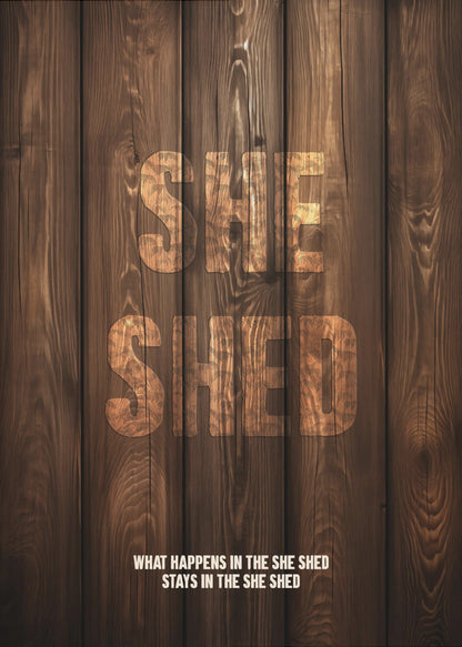 A rustic poster with a dark brown wood panel background. The words 'SHE SHED' are in large, blocky letters with a distressed wood texture. Below, a smaller caption reads 'WHAT HAPPENS IN THE SHE SHED STAYS IN THE SHE SHED'. The poster is displayed in a thin black frame. Print