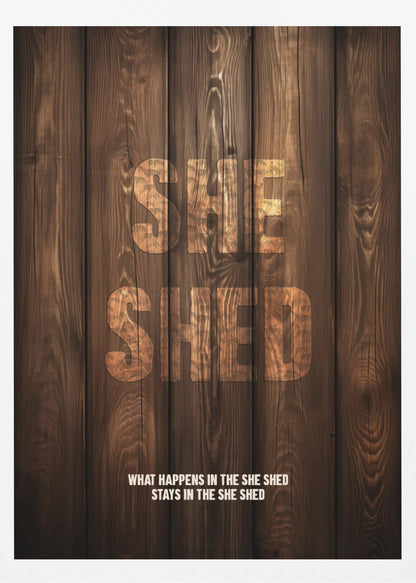A rustic poster with a dark brown wood panel background. The words 'SHE SHED' are in large, blocky letters with a distressed wood texture. Below, a smaller caption reads 'WHAT HAPPENS IN THE SHE SHED STAYS IN THE SHE SHED'. The poster is displayed in a thin black frame. Print