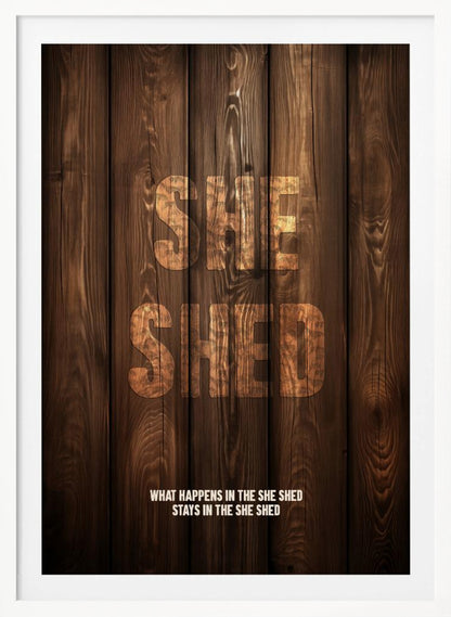 A rustic poster with a dark brown wood panel background. The words 'SHE SHED' are in large, blocky letters with a distressed wood texture. Below, a smaller caption reads 'WHAT HAPPENS IN THE SHE SHED STAYS IN THE SHE SHED'. The poster is displayed in a thin black frame. Print