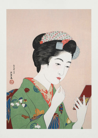 A Japanese ukiyo-e woodblock print of a woman in a green kimono applying red lipstick while looking into a small handheld mirror. Her black hair is elaborately styled, and the background is a soft pink. Artwork