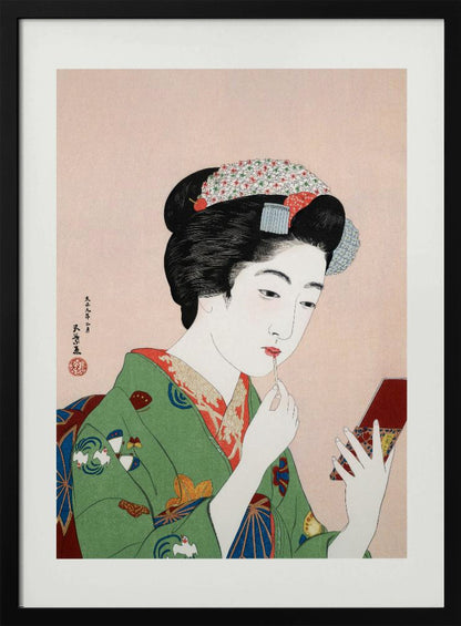 A Japanese ukiyo-e woodblock print of a woman in a green kimono applying red lipstick while looking into a small handheld mirror. Her black hair is elaborately styled, and the background is a soft pink. Artwork