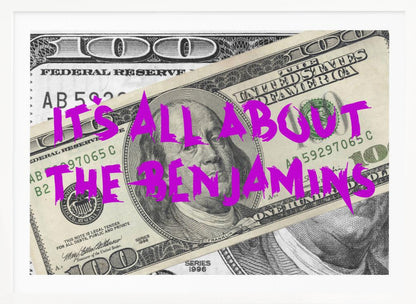A pop art piece featuring a close-up of a one-hundred-dollar bill. The phrase 'IT'S ALL ABOUT THE BENJAMINS' is written across the image in a messy, graffiti-style font in a vibrant magenta color. The artwork is set within a silver frame. Wall Art