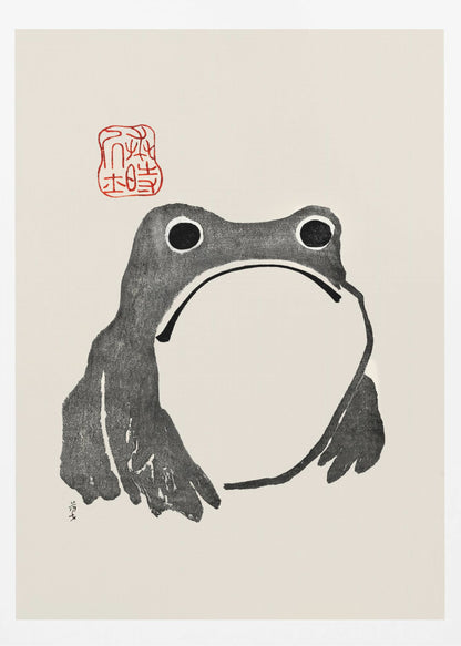 A minimalist Japanese-style ink wash painting of a stylized frog with a grumpy expression. The frog is rendered in black ink on a cream-colored paper, with a large white throat pouch. A red artist's seal is stamped above the frog's head. The artwork is presented in a simple black frame. Artwork