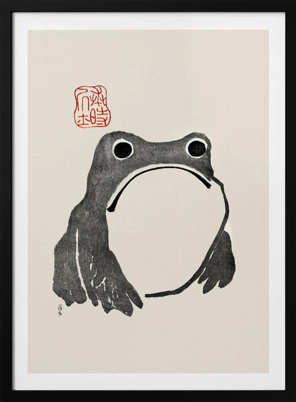 A minimalist Japanese-style ink wash painting of a stylized frog with a grumpy expression. The frog is rendered in black ink on a cream-colored paper, with a large white throat pouch. A red artist's seal is stamped above the frog's head. The artwork is presented in a simple black frame. Artwork