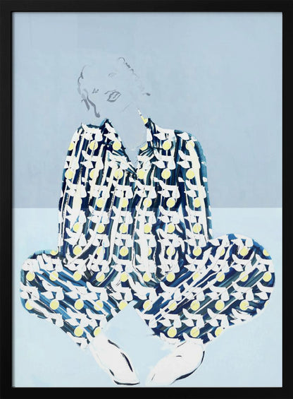 A framed fashion illustration of a person sitting cross-legged against a light blue background. The figure wears a bold, patterned blue, white, and yellow outfit, while their face and hair are rendered as faint, delicate line drawings. Wall Art