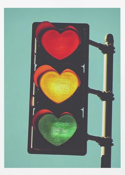 A vertical traffic light against a solid teal sky, with its red, yellow, and green signals all shaped like glowing hearts. Wall Art