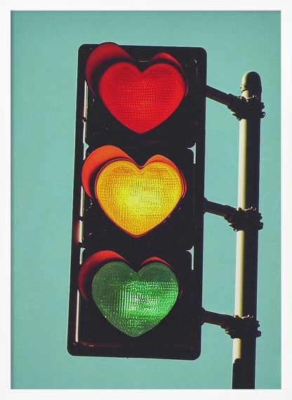 A vertical traffic light against a solid teal sky, with its red, yellow, and green signals all shaped like glowing hearts. Wall Art