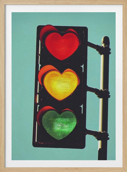 A vertical traffic light against a solid teal sky, with its red, yellow, and green signals all shaped like glowing hearts. Wall Art